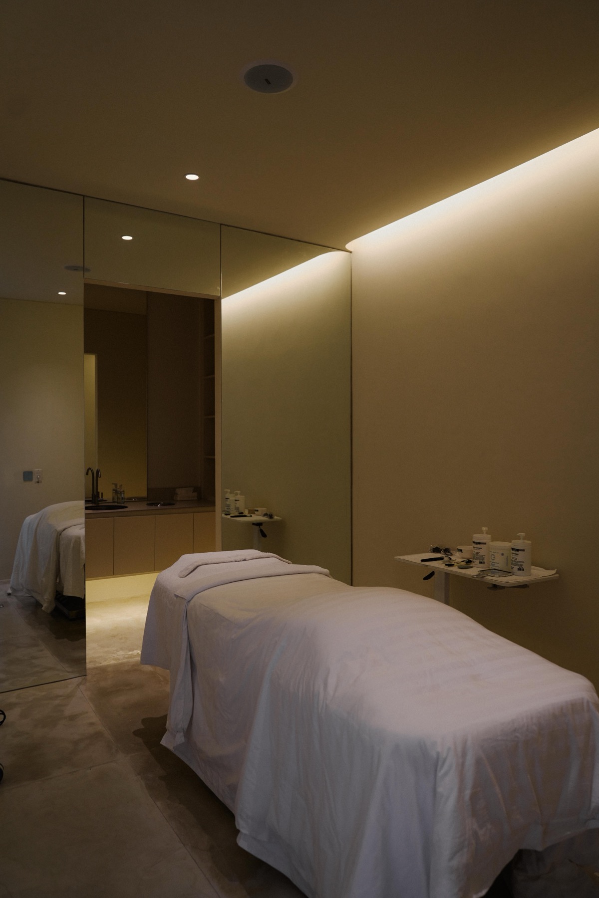Treatment room at Aesthé SkinLab under warm cove lighting